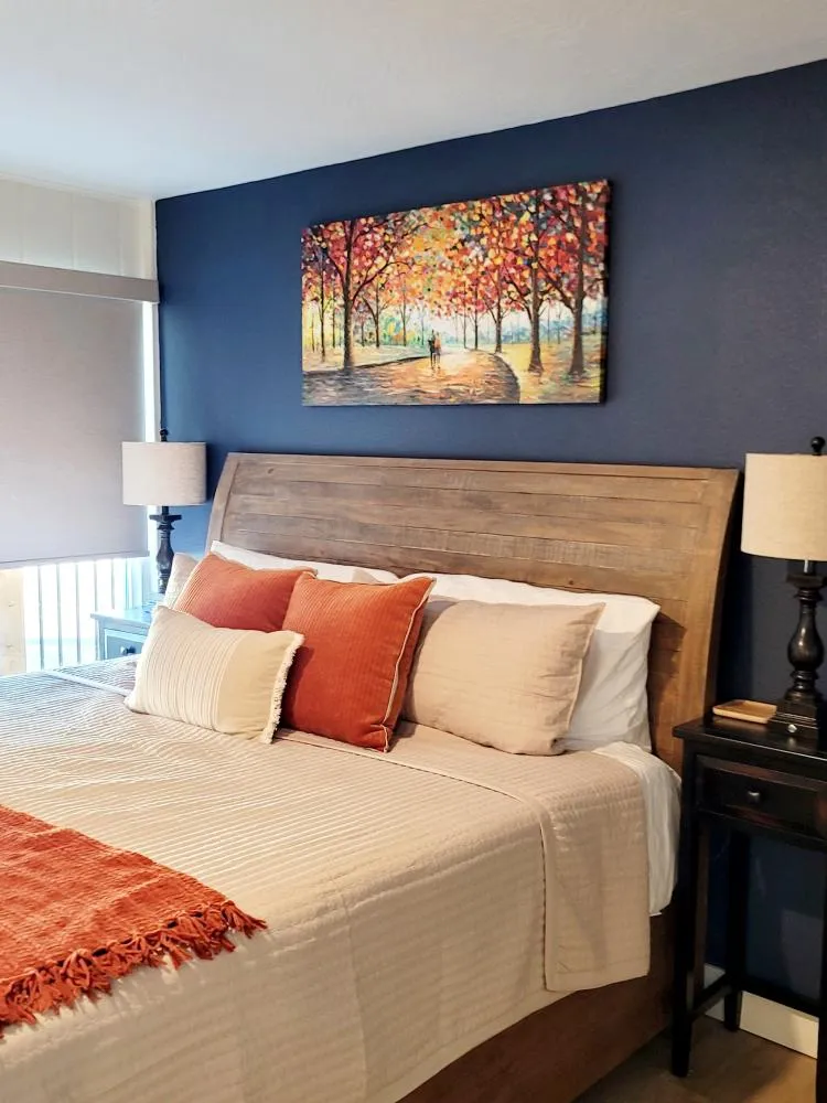 King bed topped with a Temper-Pedic mattress topper