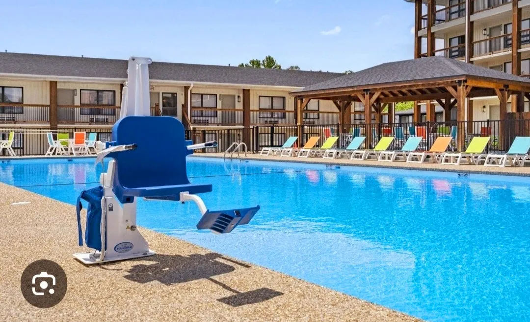 Large outdoor pool equipped with a 
handi-capped lift chair